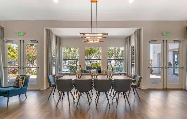 The clubhouse features large tables ideal for gatherings, whether you're hosting a small get-together, working on a project, or enjoying a meal with friends at Ascent at the Galleria.