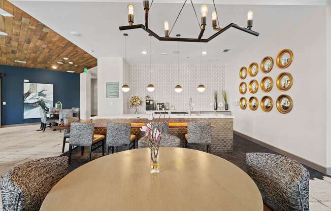 A dining room with a wooden table and chairs.