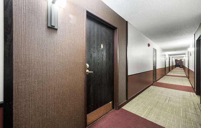 a hallway of elevators and doors