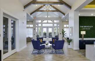 the bradley living room with blue chairs and a table