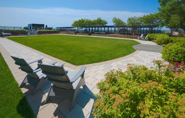 Lush rooftop lawn with ample seating