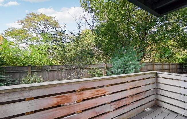Wooden deck with a view of a backyard at Park77 Apartments, Cambridge