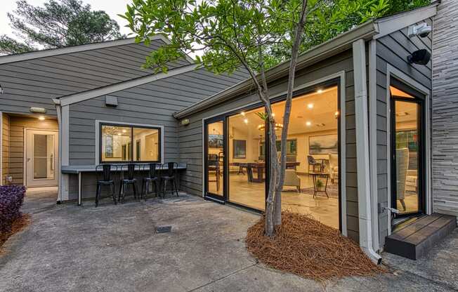 Wynnwood Vinings resident poolside lounge patio with bar and glass entrance door