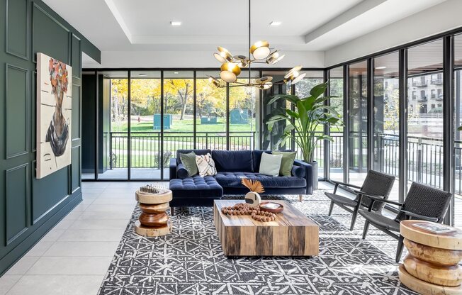 Lobby seating with floor to ceiling windows overlooking green landscaping in Minneapolis