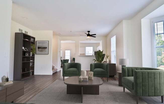 A living room with a green chair and a grey rug.