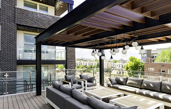 a patio with a covered couch at Lotus Republic Apartments for rent in Downtown Salt Lake City, Utah