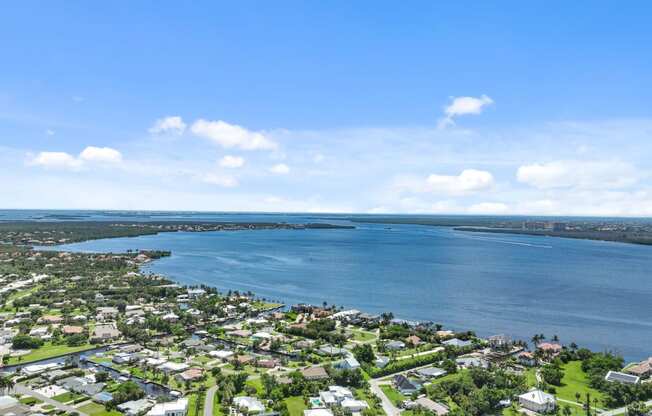 an aerial view of a city with a body of water