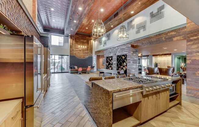 A modern kitchen with a wooden island and stainless steel appliances.