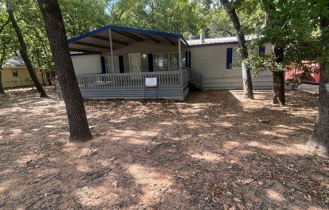 Completely remodeled 4 bed 2 bath on a large fenced tree'd lot near Granbury Lake.