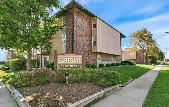 an image of the entrance to an apartment building with a sign that says eastgate apartments