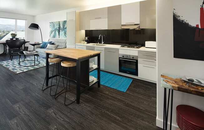 A modern kitchen with a dining table and chairs.