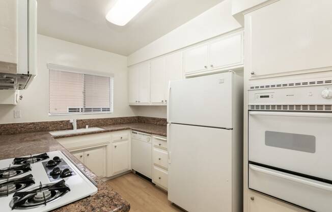 Kitchen with White Cabinets and White Appliances