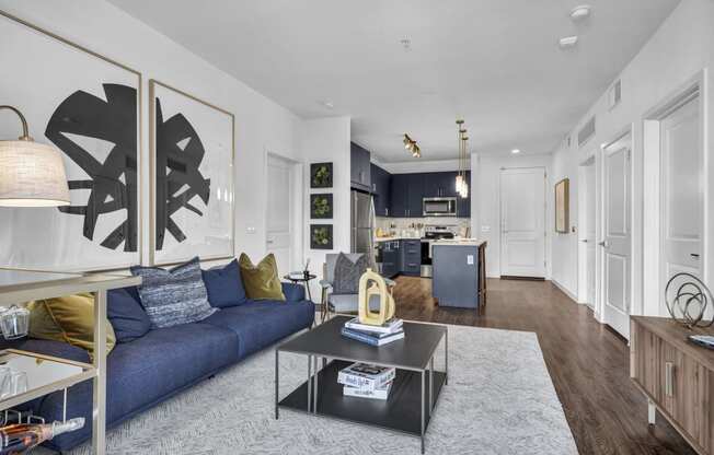 a living room with a blue couch and a coffee table