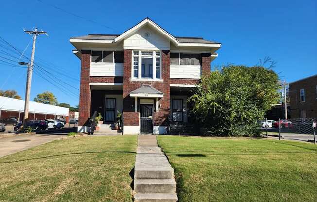 A house with a white front porch and a black door.