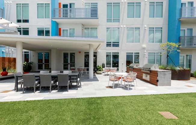 grilling patio with dining area on amenity deck at Lake Nona Pixon, Orlando, Florida