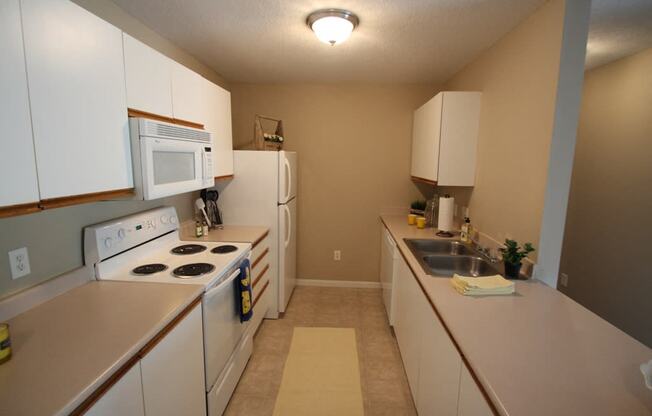 This is a photo of the kitchen in the 1040 square foot 2 bedroom Patriot at Washington Place Apartments in Washington Township, OH.