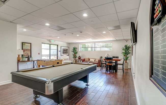 a pool table in the living room of a house