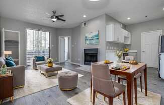 an open living room and dining room with a table and chairs