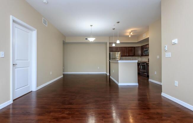 a large empty room with a hard wood floor