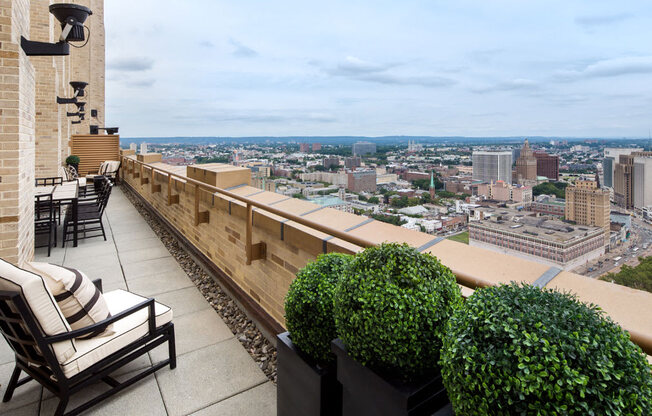 Apartments for Rent in Newark NJ-Eleven80 Apartments Rooftop Terrace With Seating And Planters And City Views