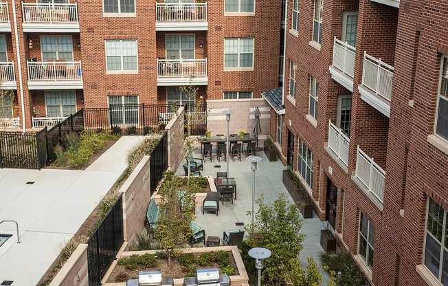 Urban Courtyard With BBQ & Seating Areas