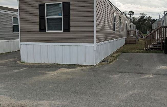 Newer mobile home with 3 bedrooms & 2 full bathrooms.