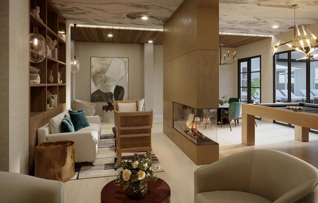 The resident lounge at Modera Liberty Row offers cozy seating, a fireplace, and game space, perfect for relaxing or entertaining in Charlotte.