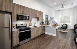 a kitchen with a stove and a refrigerator