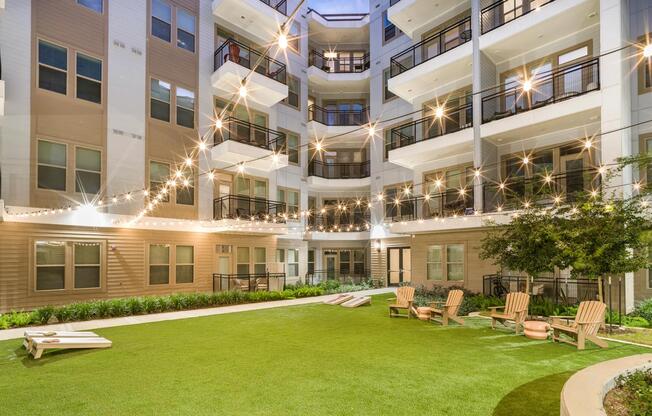 Unwind in our lush courtyard, featuring landscaped greenspace and a cozy fire pit, perfect for relaxing evenings.