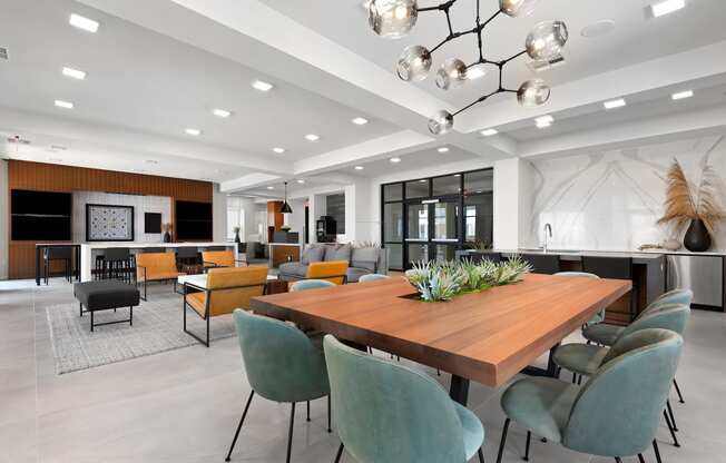 a large dining room with a wooden table and chairs
