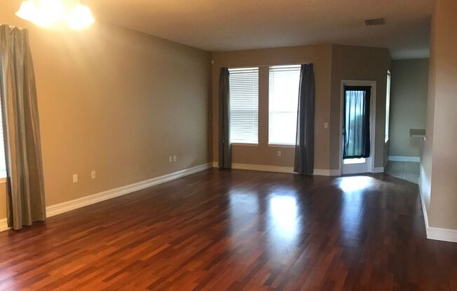 MOVE IN SPECIAL- Charming 3/2 home w/ formal office/4th bedroom and fenced yard in Harmony