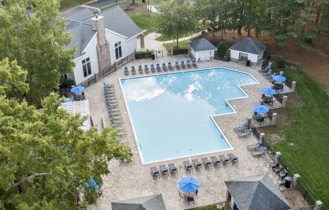 arial view of a swimming pool at a resort with umbrellas at Trails at Short Pump Apartments, Virginia, 23233