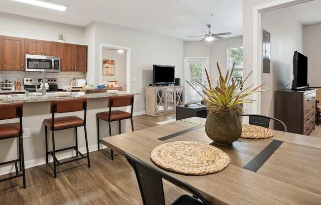 an open kitchen and dining room with a table and chairs