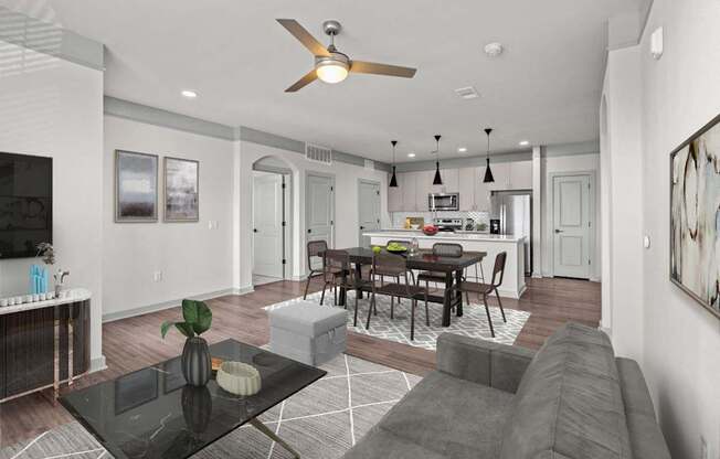 A modern living room with a black coffee table and grey sofa.