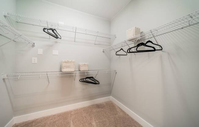 our spacious closets are stocked with shoes and bags in our spacious walk in closet