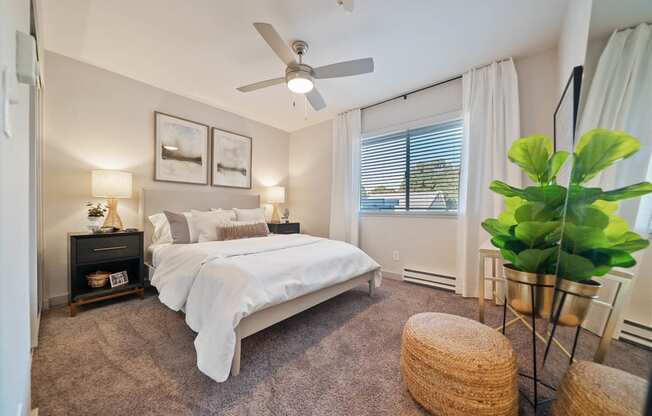 a bedroom with a bed and a ceiling fan at Bay Village, Vallejo, California