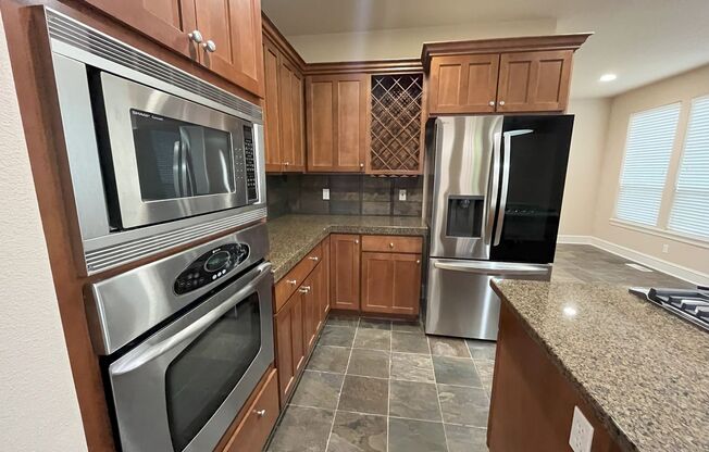 Elegant 4-Bed, 2.5-Bath Home with Gourmet Kitchen, Expansive Primary Suite & Lush Backyard Retreat