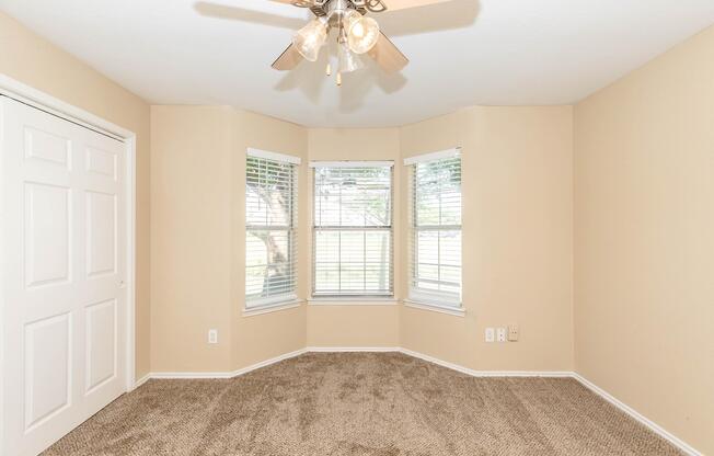 a bedroom with a large window