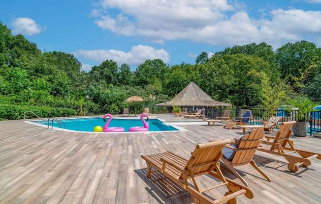 The Haverly at Stone Mountain Apartments in Stone Mountain Georgia photo of a swimming pool with deck chairs around it