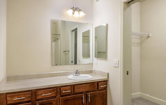 a room with a sink and a mirror