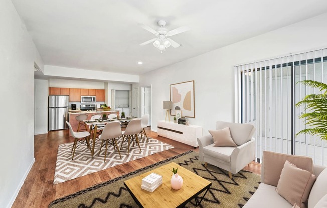 virtually staged living and dining room with hardwood-style flooring, ceiling fan, and sliding-door patio access