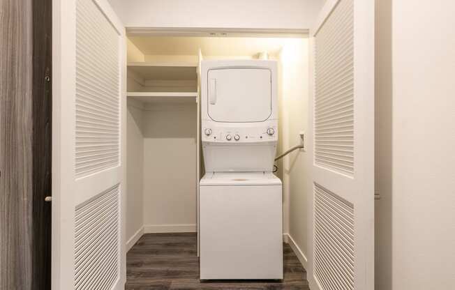 a washer and dryer in a closet in a room with a washing machine