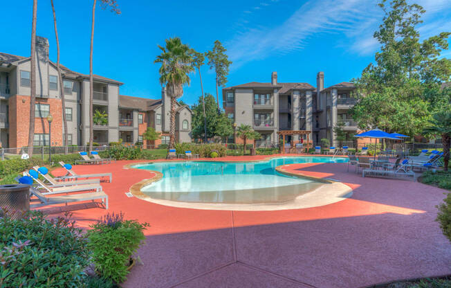 Apartments for Rent in Spring TX - Edgewater at Klein - Large Pool Surrounded by Lounge Seating