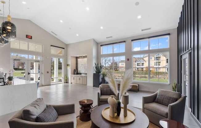 A modern living room with a large window overlooking a residential area.