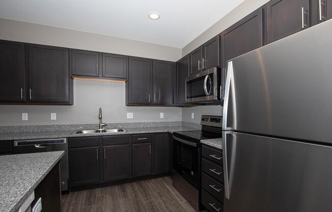 a large kitchen with stainless steel appliances