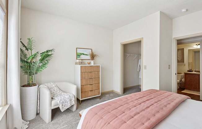 Well-lit bedroom with soft tones and ample closet space at Tattersall Village Apartments, Hinesville, Georgia