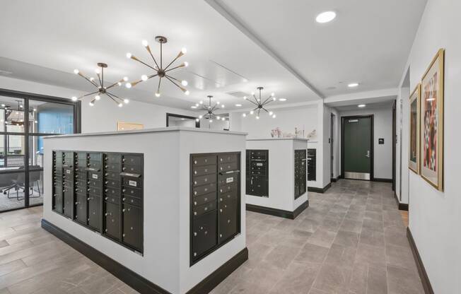 the tasting room has a wall of wine cabinets and a long hallway with a door