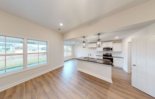 Open-Concept Home with Modern Upgrades Featuring Hardwood Flooring and Open Kitchen