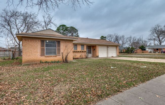 Three bedroom, 1.5 bathrooms, and a two car garage.