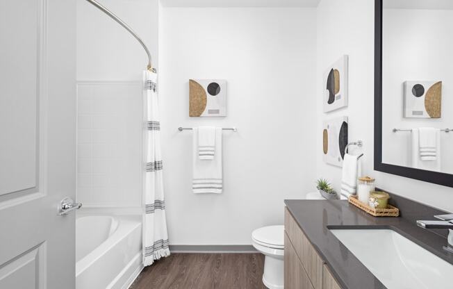 a bathroom with a shower and a sink and a toilet at Palm Grove in Ellenton, FL 34222